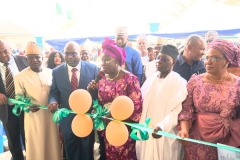 Representative of Kogi State Governor, Dr. Folashade Ayoade, Secretary to  the State Government  cutting the tape to mark the opening of the new office