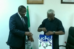 Executive Vice Chairman of NCC, Prof. Umar Danbatta, receiving some publications from ICPC Chairman, Mr. Ekpo Nta