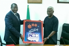 Executive Vice Chairman of NCC, Prof. Umar Danbatta, presents a souvenir to ICPC Chairman, Mr. Ekpo Nta