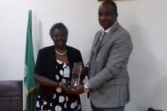 ICPC Acting chairman, Dr. Musa Usman Abubakar, presenting a commemorative plaque to Ms. Olajumoke Simplice during the courtesy visit