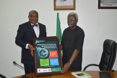 Chief-Okoi-Oboni-Obla-presenting-a-framed-poster-to-ICPC-Chairman-Mr.-Ekpo-Nta