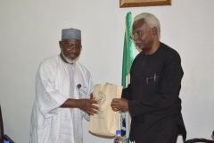 DSC_0062-ICPC-Chairman-Mr.-Ekpo-Nta-presenting-some-of-the-Commissions-IEC-materials-to-Dr.-Mohammed-Sanusi