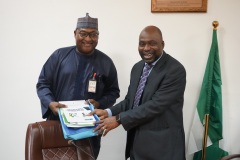 ICPC Chairman Prof. Bolaji Owasanoye, SAN presenting the National Ethics and Integrity Policy to the Executive Secretary Nigerian Shippers Council Barr. Bello Hassan