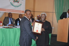 ICPC-Chairman-Ekpo-Nta-receiving-the-Award-of-Fellowship-of-the-Institute-of-Corporate-Administration-from-Dr.-Godswill-C.-Onyekwere-Chief-Learning-Officer-ICAD-Abuja