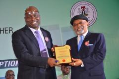 ICPC Chairman, Prof. Bolaji Owasanoye, presenting a plaque to the Minister of Labour and Employment, Dr Chris Ngige, who was the Chairman of the fifth session.