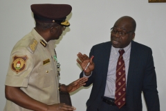 ICPC Chairman, Prof Bolaji Owasanoye discussing with Comptroller-General of Nigeria Immigration Service, Mohammed Babandede